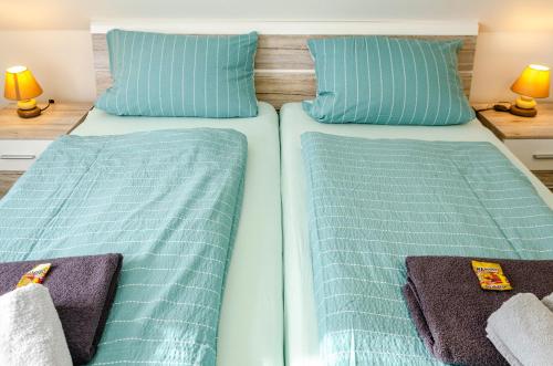 Una cama o camas en una habitación de Robbe 2