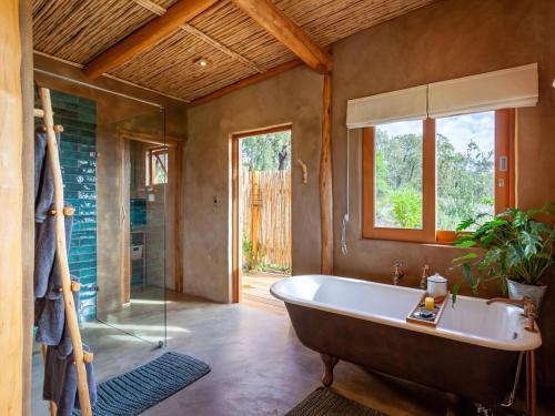 a large bathroom with a tub and a window at Goodluck Homestead in Stanford
