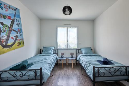 Posteľ alebo postele v izbe v ubytovaní Maison Ariel - Charmante maison pour 6