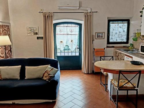 a living room with a couch and a table at La Piccola Oasi con parcheggio in Florence