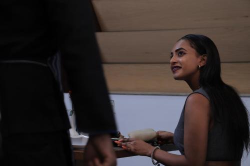 a woman standing next to a man in a room at Tolip Olympia Hotel in Addis Ababa