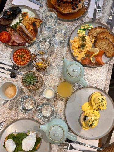 a table with many plates of food on it at The Arran, St Andrews in St. Andrews