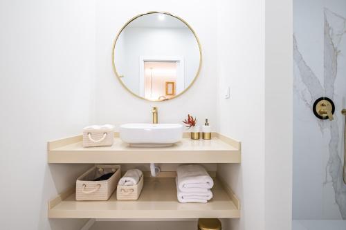 a bathroom with a sink and a mirror at Machim D Arfet House by Homie in Machico