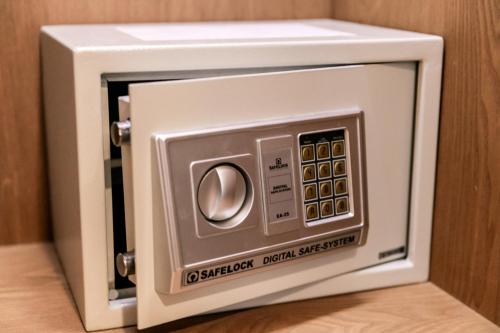 a white microwave oven sitting on top of a table at Golden Tulip Incheon Airport Hotel in Incheon