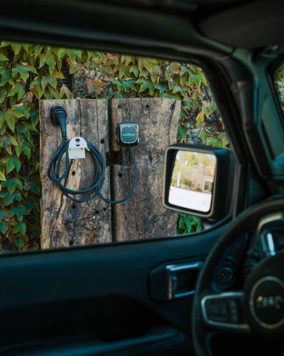 a car window with a hose attached to a wooden door at La Guest House della Tenuta di Tavignano in Cervidone