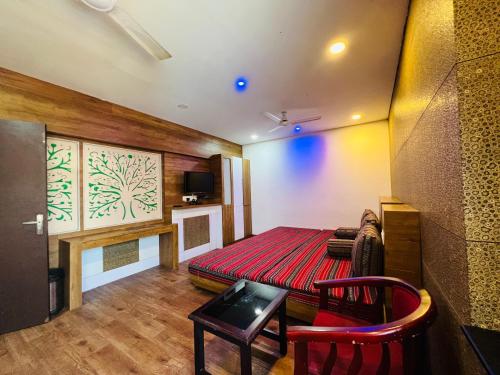 Télévision ou salle de divertissement dans l'établissement TCS SUITES