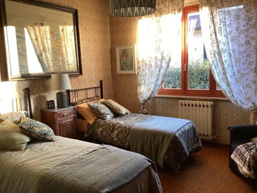 Ένα ή περισσότερα κρεβάτια σε δωμάτιο στο Appartamento di lusso in Villa Riccardo Barga