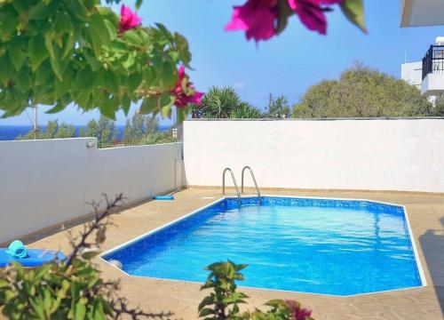 a swimming pool in the backyard of a house at Villa Only 50m To The Sea, Sleeps 12, Polis in Pomos