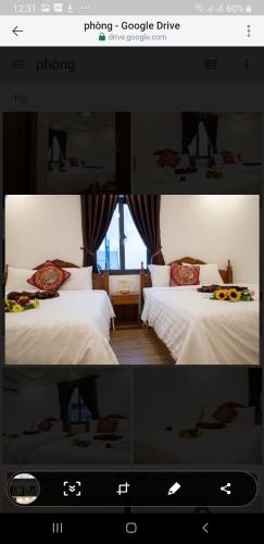 a picture of a hotel room with two beds at Money Fine Quy Nhơn - Khách sạn dát vàng in Quy Nhon