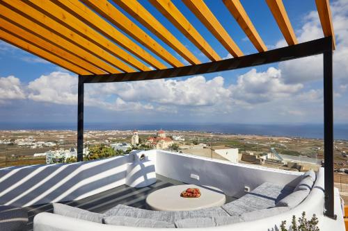 a view from the balcony of a house at Aecon Suites in Éxo Goniá