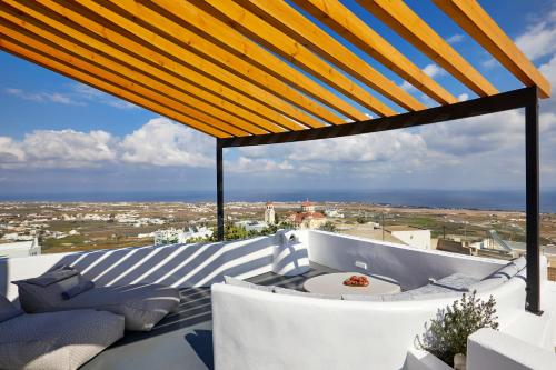 a view from the balcony of a house at Aecon Suites in Éxo Goniá