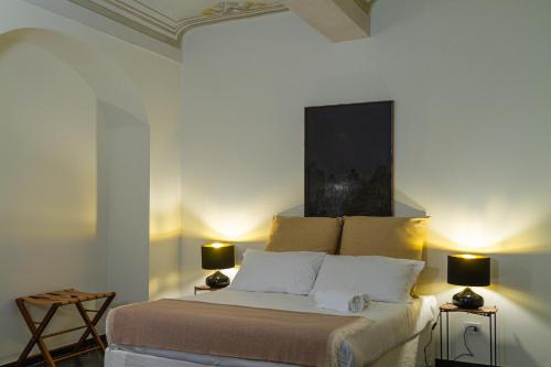 Ένα ή περισσότερα κρεβάτια σε δωμάτιο στο Palazzo Glori 6