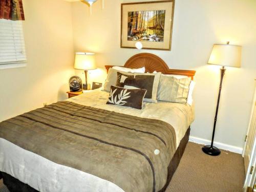 a bedroom with a large bed with two lamps at ML229 Mountain Escape! Great for relaxing! 2BR 2BA in Snowshoe