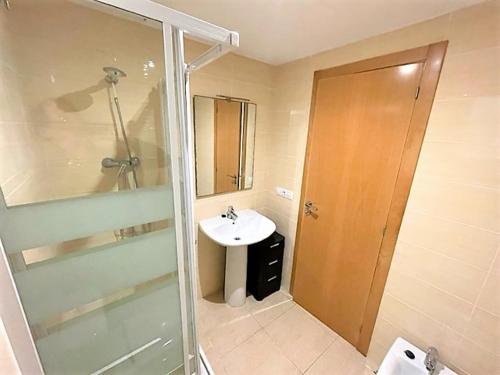 a bathroom with a sink and a shower and a toilet at Apartamento Grao de Moncofar REF. 041 in Moncófar
