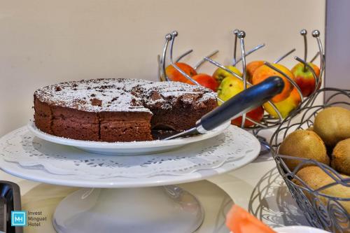 a chocolate cake on a plate on a table at Hotel De La Couronne Liege in Liège