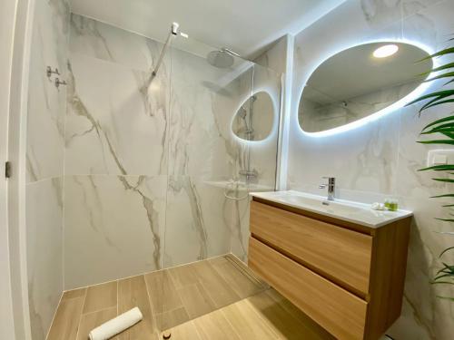 a bathroom with a sink and a mirror at Chill in paradise in Playa Paraiso