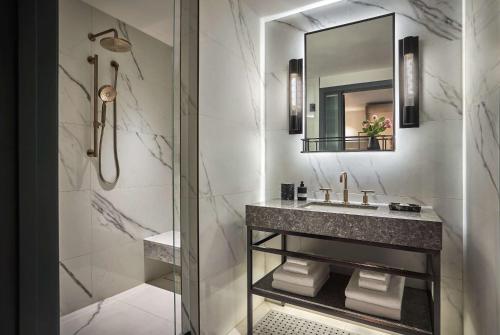 a bathroom with a sink and a mirror at Pendry Washington DC - The Wharf in Washington