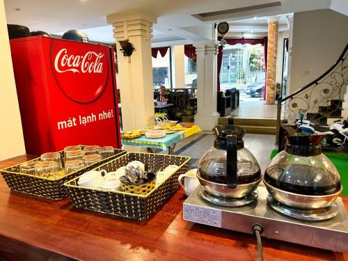 a counter with two baskets of food and a cocacolaacistacistacistacist at Ha Long Starlight Hostel in Ha Long