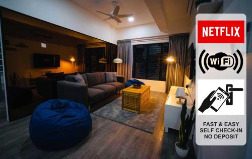 a living room with a couch and a sign at Genting View Resort GVR Kempas in Genting Highlands