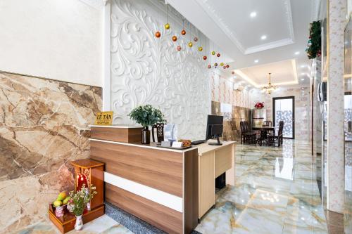 a lobby of a hotel with a reception desk at Joi Home The Hidden Villa in Vung Tau