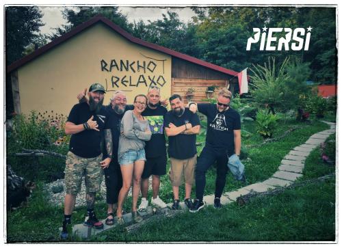 a group of people posing for a picture in front of a building at Rancho Relaxo Czartoria in Miączyn