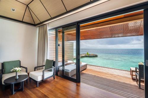 a room with a view of the ocean at Lily Beach Resort and Spa - All Inclusive in Dhangethi
