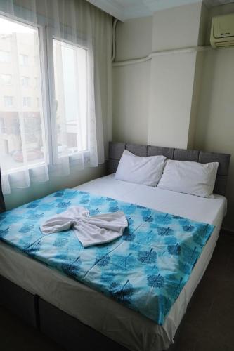 Llit o llits en una habitació de Hotel Resat