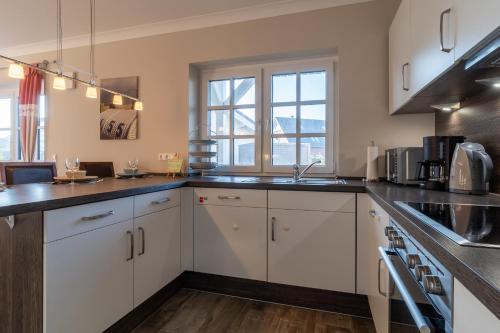 Η κουζίνα ή μικρή κουζίνα στο Freetied Appartement Freetiet Achtern Diek