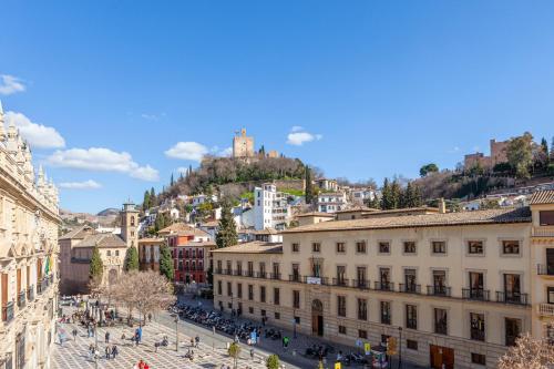 a view of a city with a castle on a hill at Hotel Macià Plaza in Granada