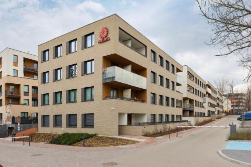 an apartment building on a city street at Fredry 6 Apartment Premium Łagiewniki by Renters Prestige in Kraków