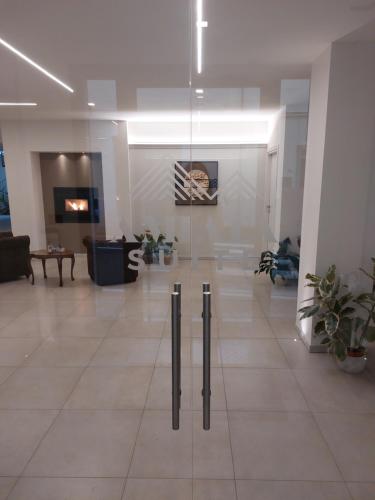 a lobby with a glass door in a building at Amiata Suite in Abbadia San Salvatore
