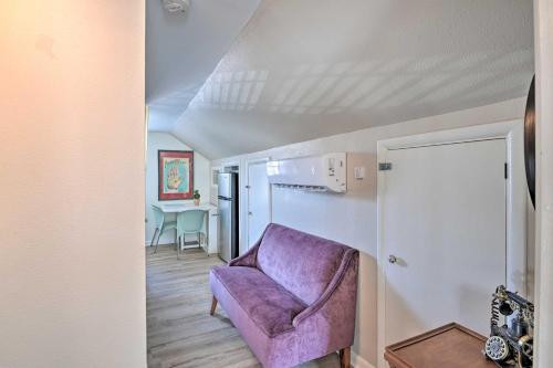 a living room with a purple couch and a table at Spacious Lexington Studio 2 Miles to Rupp Arena in Lexington