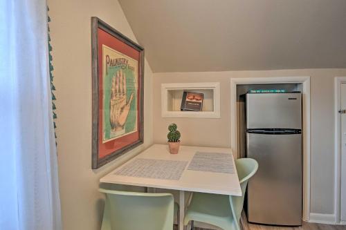 a small kitchen with a table and a refrigerator at Spacious Lexington Studio 2 Miles to Rupp Arena in Lexington
