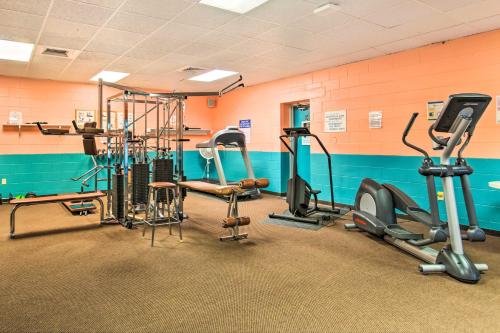 a gym with several exercise equipment in a room at Walk to Indian Beach Condo with Ocean-View Balcony in Indian Beach