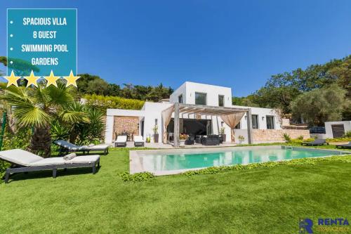 a villa with a swimming pool in a yard at Cannes Hills Lovely Villa Pool & Garden in Le Cannet