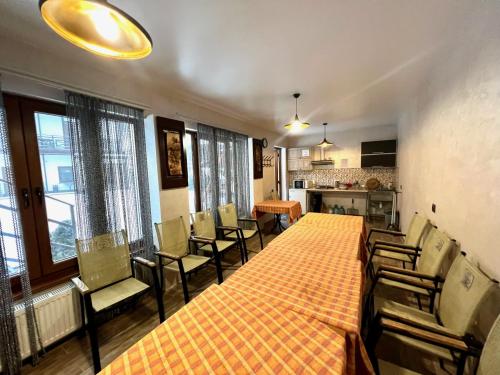 a large room with a long table and chairs at Viktan Hotel in Bukovel