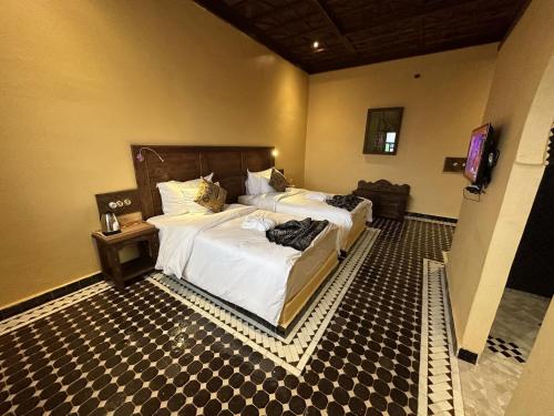 Hotel Riad Xalucaにあるベッド