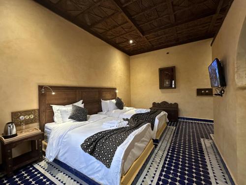 Hotel Riad Xalucaにあるベッド
