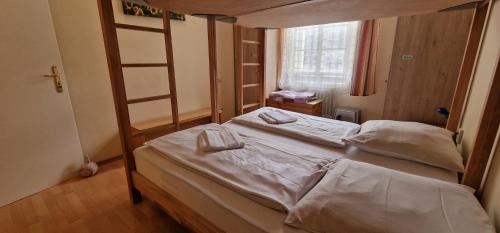 Postel nebo postele na pokoji v ubytování ciao-aschau Haus zur Burg Ap104 Pabst