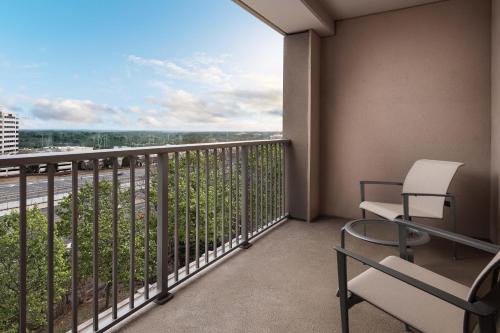 a balcony with a chair and a view at The Westin Reston Heights in Reston