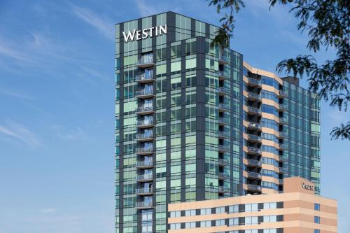 a tall building with a sign on top of it at The Westin Edina Galleria in Edina