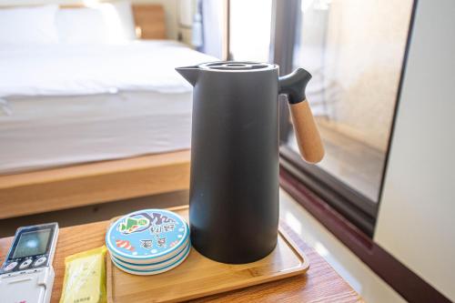 Una cama o camas en una habitación de 別野城北