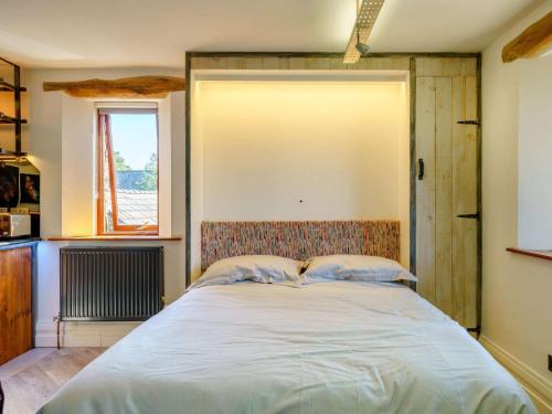 a bedroom with a large bed in a room at The Artist Studio in Hest Bank