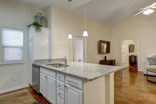 a kitchen with a sink and a counter top at Anegada Village Dreamcicle in Padre Island