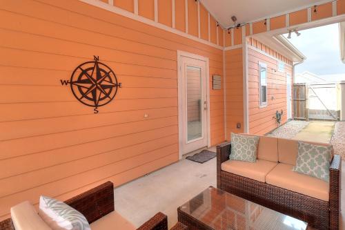 a screened porch with a couch and a window at Anegada Village Dreamcicle in Padre Island
