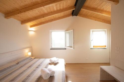 Postel nebo postele na pokoji v ubytování Agriturismo Eos