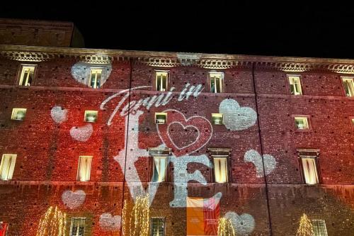 a large red brick building with a heart painted on it at Bilocale degli Innamorati in Terni