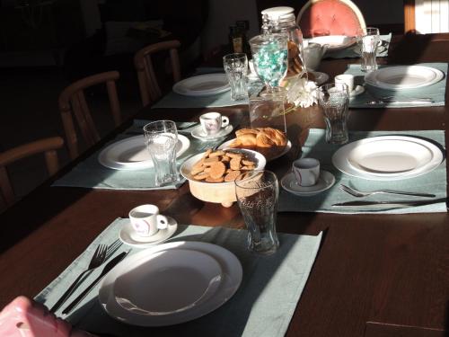a table with plates of food on top of it at Il Chicco apartment in Lamporecchio