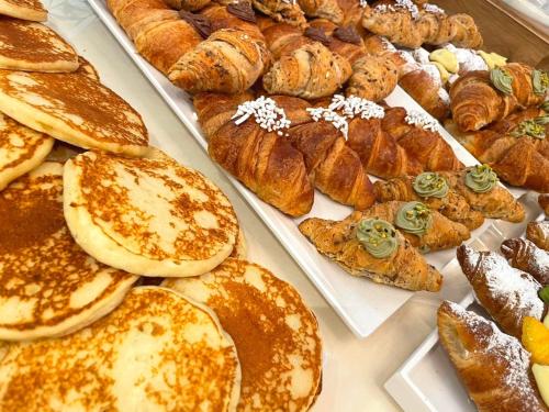 a bunch of pastries and croissants and other baked goods at Hotel Selene - Vista Mare in Riccione