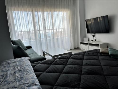 Posteľ alebo postele v izbe v ubytovaní VER853 - Estudio con terraza vistas al mar, Piscina, Playa, Centro
